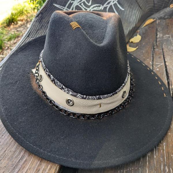 Felt hat placed on a wooden bench